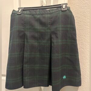 Pleated green plaid skirt w shamrock embroidered in bottom corner